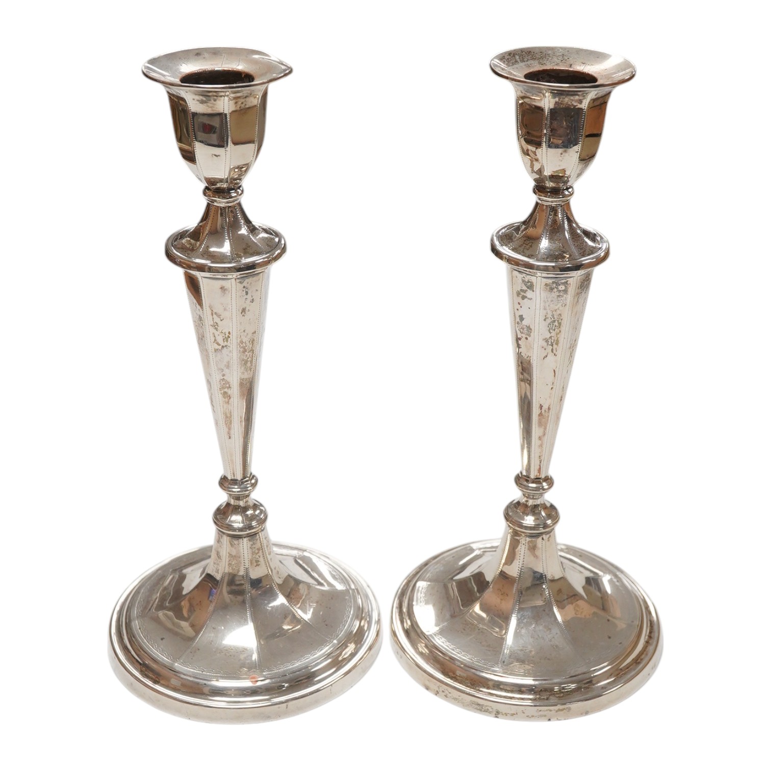 A pair of Edwardian silver candlesticks, by Fordham & Faulkner, Sheffield, 1905, 20.4cm, weighted. Condition - fair